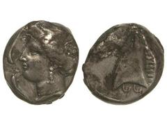 Tetradracma. 350-325 a.C. ZEUGITANIA. Anv.: Cabeza femenina a izquierda rodeada por cuatro delfines. Rev.: Cabeza de caballo a izquierda, detrás (palmera), debajo letras púnicas. 16,60 grs. AR. (Rayit