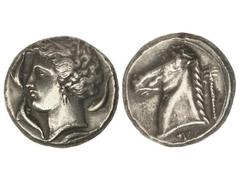 Tetradracma. 350-325 a.C. ZEUGITANIA. CARTAGO. Anv.: Cabeza femenina a izquierda rodeada de cuatro delfines. Rev.: Cabeza de caballo a izquierda, detrás palmera, debajo leyenda púnica. 17,10 grs. AR. 