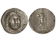 Tetradracma. 351-344 a.C. HIDRIEUS. Anv.: Cabeza laureada de Apolo de frente. Rev.: Zeus en pie a derecha, sosteniendo labrys y lanza. 14,52 grs. AR. (Golpes). Se-4958. MBC-.