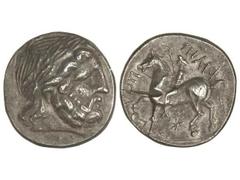 Tetradracma. Siglo III a.C. FILIPO II. IMITACIÓN CELTAS DEL DANUBIO. Anv.: Cabeza laureada de Zeus a derecha. Rev.: Jinete a izquierda, alrededor leyenda y símbolos. 14,10 grs. AR. Ex Spink. (Corte de