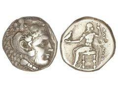 Tetradracma. 336-323 a.C. ALEJANDRO MAGNO. MACEDONIA. Anv.: Cabeza de Hércules con piel de león a derecha. Rev.: Zeus entronizado a izquierda, detrás leyenda. 15,95 grs. AR. (Rayas y golpes). Cy y Mül