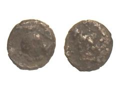 GREEK COINS Tetartemorion. Siglo V a.C. ASIA MENOR. Anv.: Cabeza ¿janiforme?. Rev.: Cabeza femenina a derecha. 0,14 grs. AR. BC+.