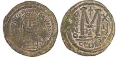 BYZANTINE COINS Justinien 1er - Follis (527-563, Constantinople) A/ D N IVSTINIANVS PP AVG. Buste de face casqué tenant un globe surmonté d'une croix. Une croix dans le champ. R/ Un large M, au-dessus