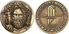 MEDAILLEN SPORT. OLYMPISCHE SPIELE. Olympische Komitees. ATHEN Medaille 1996 auf 100 Jahre Olympische Spiele der Neuzeit 1896-1996. Zeuskopf v.v. mit Nikestatuette (Motiv d. 1 Siegermedaille) / Stilis