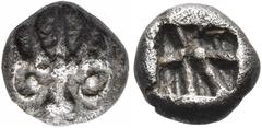 The Jonathan H. Kagan Collection of Ancient Greek Coins ASIA MINOR. Uncertain mint. 6th century BC. Obol (Silver, 7 mm, 0.69 g). Stylized lion's head facing, wearing a crown with five rays. Rev. Incus