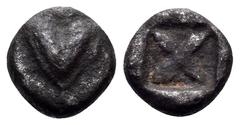 Greek KYRENAIKA. Kyrene. Circa 500-480 BC. Tetartemorion (Silver, 5.5 mm, 0.20 g). Silphium fruit, with pellet above and below. Rev. Four pointed star formed by four lotus buds with a large pellet at 