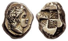 GREEK COINS Mysia -. Stater (Electrum, 16.10 g), c. 380 BC. Head of youthful Pan to right, wearing an ivy wreath and with a goat’s ear; below truncation, tunny fish to right. Rev. Quadripartite incuse