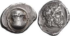 Greek Coins BOEOTIA. Thebes. Circa 425-395 BC. Stater (Silver, 22 mm, 12.17 g, 3 h). Boeotian shield; horizontally on upper half of the shield, club to left. Rev. [Θ] - Ε Head of Dionysos to right, be