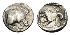 Greek CARIA OR LYCIA. Uncertain. Circa 5th century BC. Tetartemorion (Silver, 6 mm, 0.16 g, 10 h). Forepart of boar to right. Rev. Lion standing to left; above to right, wreath-like symbol; all within