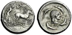 The M.L. Collection of Coins of Magna Graecia and Sicily Syracuse Tetradrachm circa 480-475, AR 17.27 g. Slow quadriga driven r. by bearded charioteer, wearing chiton and holding kentron and reins; ab