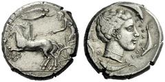 The M.L. Collection of Coins of Magna Graecia and Sicily Syracuse Tetradrachm circa 440-430, AR 17.41 g. Prancing quadriga driven l. by charioteer, holding kentron and reins; above, Nike flying r. to 