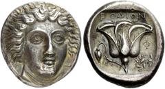 Greek Coins Islands off Caria, Rhodes. Tetradrachm circa 404-385 BC, AR 15.23 g. Description Head of Helios facing three-quarters r. Rev. POΔION Rose with single bud on l., in r. field, Φ / wreath. Al