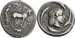 Greek Coins Syracuse. Tetradrachm of the Demareteion series circa 465, AR 17.38 g. Slow quadriga driven r. by charioteer, wearing chiton, holding reins in both hands and kentron in l.; above, Nike fly