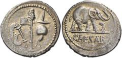 The Roman Republic Iulius Caesar. Denarius, mint moving with Caesar 49-48, AR 3.78 g. Pontifical emblems: culullus, aspergillum, axe and apex. Rev. Elephant r., trampling dragon; in exergue, CAESAR. B