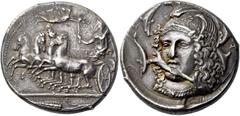 Greek coins Syracuse. Tetradrachm, signed by Eukleidas circa 405-400, AR 17.27 g. Fast quadriga driven l. by female charioteer, holding reins in l. hand and raising flaming torch in r.; above, Nike fl