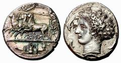 Greek Coins Syracuse Decadrachm signed by Kimon circa 404-400,  AR 42.60 g.  Fast quadriga driven l. by charioteer, holding reins and kentron; in field above, Nike flying r. to crown him. On the exerg