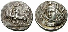 A remarkable selection of Greek Coins Syracuse Tetradrachm signed by Eucleidas circa 405-400, AR 17.27 g. Fast quadriga driven l. by female charioteer, holding reins in l. hand and raising flaming tor