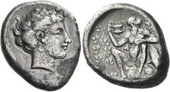 Greek Coins. Naxos. Tetradrachm circa 410-405, AR 16.75 g. [ΝΑΞΙΩΝ] Wreathed head of Dionysus r. Rev. Nude and bearded Silenus seated l. on wine skin, head l., holding cantharus in r. hand and ivy bra
