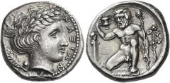 Greek Coins. Naxos. Didrachm circa 430-415, AR 8.67 g. NAΞIΩN Laureate head of Apollo r.; behind, laurel leaf with berry. Rev. Squatting naked Silenus, holding cantharus in uplifted r. hand and thyrsu