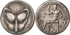 Italy. Bruttium, Rhegium. Tetradrachm, c. 450 - 445 BC. (Silver, 17.35g., 25.6mm). Lion’s mask facing; border of dots / RECI – NOS Iokastos, bearded and nude to the waist, seated left on a stool, hold