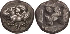 Northern Greece. Macedon, Akanthos. Tetradrachm, c. 500 BC. (Silver, 17.18g., 23.7mm). Lion to right, attacking bull, collapsing to left with its head raised; below, going through the exergual line, f