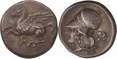 Southern Greece. Corinthia, Corinth. Stater, c. 340 BC. (Silver, 8.53g., 21.4mm). Pegasos with pointed wing flying to left; below, Ϙ / Female head to left (Athena or Aphrodite), wearing a Corinthian h