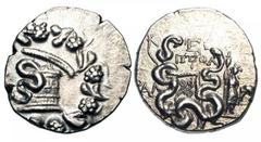 LYDIA, Tralles. After 133 BC. AR Cistophoric Tetradrachm (12.54 gm), year 5 (129 BC). Cysta Mystica / Two serpents coiled around bow-case, to right Dionysos standing leaning on thyrsos and holding mas