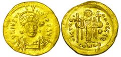 BYZANTINE EMPIRE. Justin I, 518-527 AD. Gold Solidus (4.29 gm) of Constantinople. Helmeted bust facing / Angel standing, holding cross. S.56. off B. VF+, light scuffing. [Est. $700]