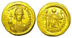 BYZANTINE EMPIRE. Justinian I, 527-565 AD. Gold Solidus (4.48 gm) of Constantinople. Armored bust facing holding orb and shield / Angel standing holding long cross and orb. S.139. Off. A. VF+/XF. [Est