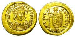 BYZANTINE EMPIRE. Anastasios I, 491-518 AD. Gold Solidus (4.39 gm) of Constantinople. Helmeted bust 3/4 facing right / Angel standing left holding cross. S.5. Off. Gamma. Mint, outstanding. Scarce.
