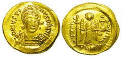 BYZANTINE EMPIRE. Justinian I, 527-565 AD. Gold Solidus (4.49 gm) of Constantinople. Helmeted bust 3/4 facing right / Angel standing. S.137. XF. Scarce.