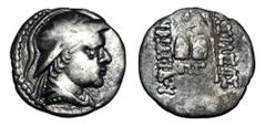 Eastern Cultures BAKTRIAN KINGDOM. Eukratides, 171-135 BC. AR Obol (0.75 gm). Helmeted draped bust / Caps of the Dioskouri, P G below. M.1723v. Toned VF.