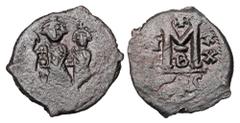 Byzantine BYZANTINE EMPIRE. Heraclius, 610-641 AD. AE Follis (4.89 gm) of Thessaloniki, yr. 20 B. Heraclius, Heraclius Constantine and Martina standing, each holding orb / Large M. S.825. VF, weak spo