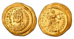 Byzantine Coins BYZANTINE EMPIRE. Justin II, 565-578 AD. Gold Solidus (4.47 gm) of Constantinople. Celmeted bust facing with Victory / Constantinopolis enthroned with spear and globus cruciger. S.348.