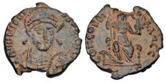 Roman Imperial Coins HONORIUS, 392-423 AD. Æ Follis (2.46 gm) of Antioch, 401/3. Helmeted and cuirassed bust with spear facing / Emperor standing with labarum and victory on globe. RIC.99. VF+, earthe