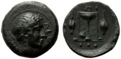 Sicily Tetras,Leontinoi, c. 405-402 BC, AE, (g 2,12, mm 14, h 2). ΛEON, head of Apollo r., Rv. Tripod flanked by two grains; in ex. three pellets. CNS, n. 3. Good very fine.
