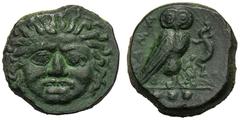 Sicily, Tetras, Kamarina, c. 425-405 BC, Ae 3,72 g, Gorgoneion, Rv. KAMA, owl standing r., holding lizard with claws in ex. three pellets. CNS III, n. 19.Green patina, good very fine.