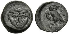 Sicily, Tetras, Kamarina, c. 420-410 BC; AE (g 3,19; mm 14; h 9); Gorgoneion, Rv. KAMA, owl standing l., holding lizard; in ex. three pellets. CNS III, n.21; SNG ANS 326.Extremely fine.