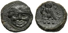 Sicily, Tetras, Kamarina, c. 420-405 BC; AE (g 3,38; mm 14; h 9); Gorgoneion, Rv. KAMA, owl standing l., holding lizard; in ex. three pellets. CNS III, n. 25.Green patina, about extremely fine.