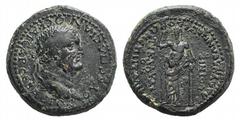 Roman Imperial Vespasian (69-79). Lydia, Blaundus. Æ (24mm, 11.23g, 6h). Ti. Claudius Phoenix, Italicus procos. Laureate head r. R/ Dionysus standing facing, leaning on column and holding thyrsus. RPC