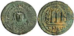 BYZANTINE TIBERIUS Constantine II, 578-582. AE Follis (14.01 gms), Theoupolis Mint (Antioch), Year 7 (580/1). S-448. Facing bust of emperor wearing crown with cross and consular robes, in right hand m