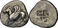 CORINTHIA. Corinth. AR Stater (8.40 gms) ca. 555-515 B.C. Cal-18. Pegasus flying left with bridles; Reverse: Swastica incuse pattern. RARE from the first issues of Corinth. VERY FINE.