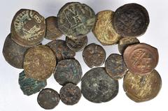 MIXED LOTS. Bronze Issues, ND (ca. 7th to 10th Century). Approximately 64 pieces in lot. A substantial grouping of Byzantine bronze issues. Includes three cardboard albums designed for U.S. Dollars, i