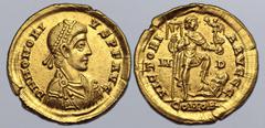Roman Imperial Honorius AV Solidus. Mediolanum, AD 394-395. D N HONORIVS P F AVG, pearl-diademed, draped and cuirassed bust to right / VICTORIA AVGGG, emperor standing to right, holding labarum and Vi