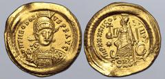 Maritime Theodosius II AV Solidus. Constantinople, AD 441-450. D N THEODOSIVS P F AVG, pearl-diademed, helmeted and cuirassed bust facing slightly to right, holding spear and shield decorated with hor