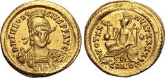 Maritime Theodosius II AV Solidus. Constantinople, AD 430-440. D N THEODOSIVS P F AVG, pearl-diademed, helmeted and cuirassed bust facing slightly to right, holding spear and shield decorated with hor