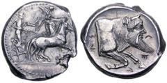 Sicily, Gela AR Tetradrachm. Circa 480-475 BC. Bearded charioteer driving quadriga to right; above, Nike flying right to crown the horses / Forepart of man-headed bull to right, CELAS around. Jameson 