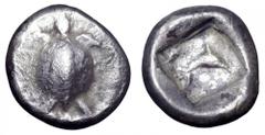 Islands off Attica, Aegina AR Obol. Islands off Attica, Aegina AR Obol. Circa 480 BC. Turtle with smooth shell, ridge down middle / Dolphin swimming right within incuse square, floral ornament in uppe