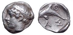 Islands off Thrace, Thasos AR Hemiobol. Islands off Thrace, Thasos AR Hemiobol. Circa 411-404 BC. Head of nymph left, hair bound with taenia / Dolphin leaping left, ΘΑΣ around. Le Rider, Thasiennes 13