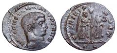 Constantine I Æ Follis. Constantine I Æ Follis. Rome, AD 313. IMP CONSTANTINVS P F AVG, bare head right / GLORIA PERPET, two Victories advancing right, both holding wreath and branch, standard between